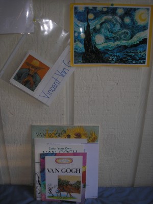 I slip the art cards into a sheet protector and then post them on our art wall.