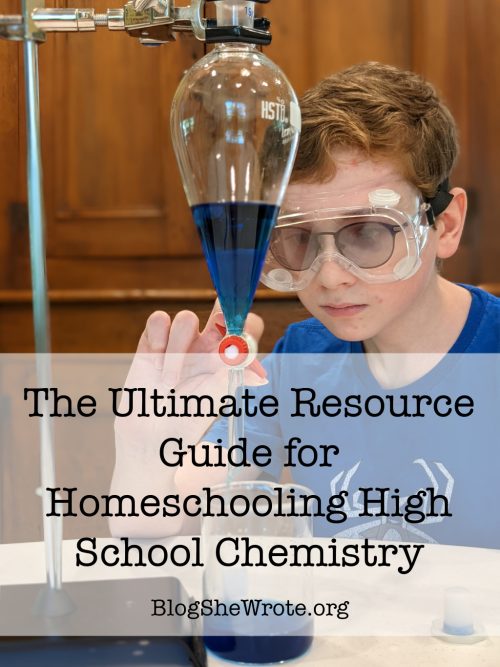 teen boy looking at a blue liquid in a sepatory funnel